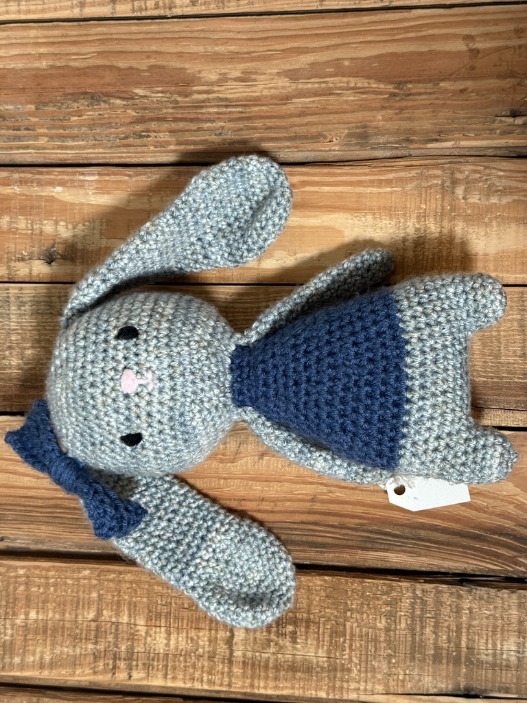 Juniper the Bunny in a navy pinafore