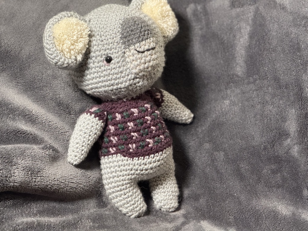 Kip the Koala in a plum bobble sweater